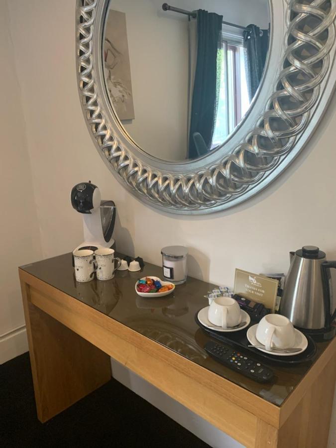 The Swan @ Stoford Hotel Buitenkant foto A Nespresso coffee machine in a hotel room